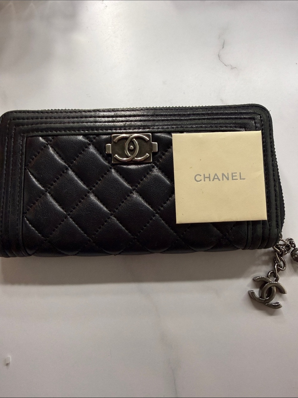 CHANEL Black Quilted Leather Zip-Around Wallet with CC Charm